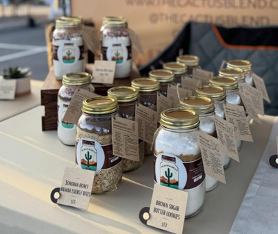 The Cactus Blend product labels on jars at a vendor market